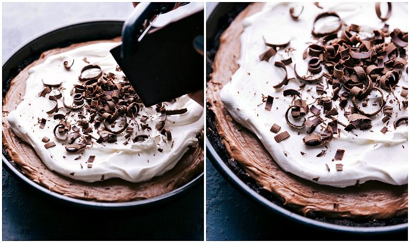 A chocolate bar being shaved on top of the dessert to make a pretty finish.