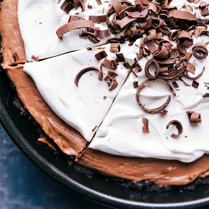 Nutella pie, with a clean cut indicating a slice ready to be lifted out, showcasing its luscious layers.
