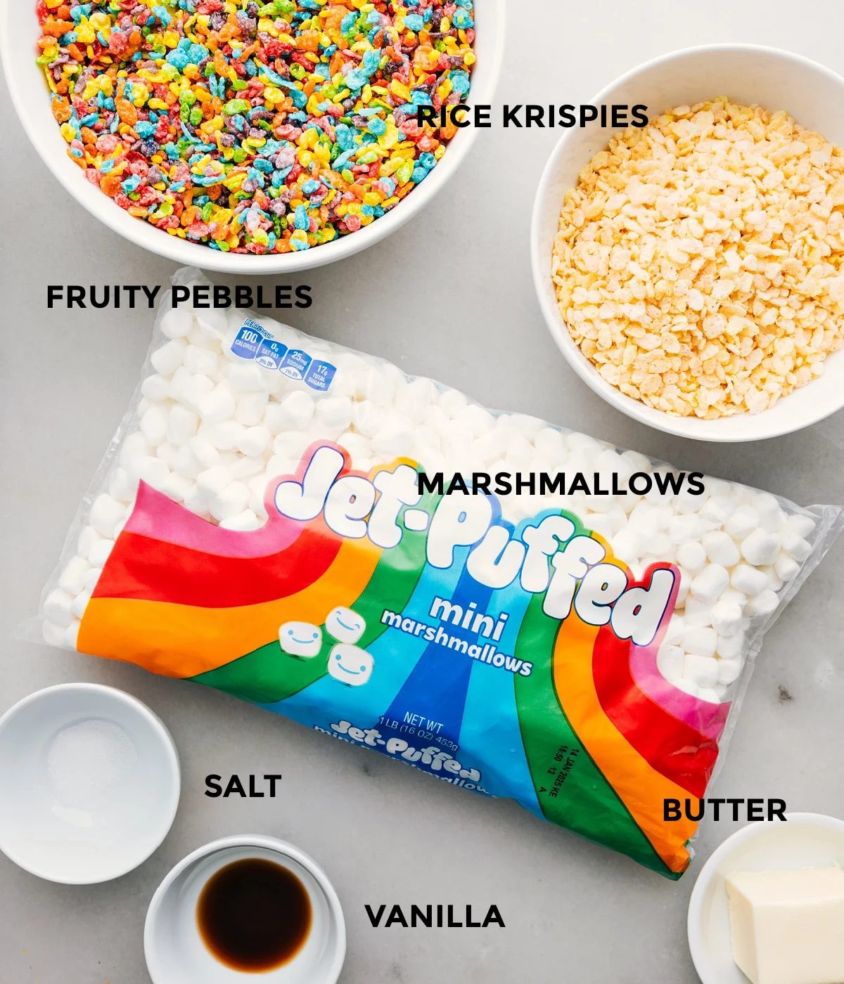The ingredients in this recipe prepped out for straightforward assembly including the cereal, marshmallows, salt, vanilla, and butter.