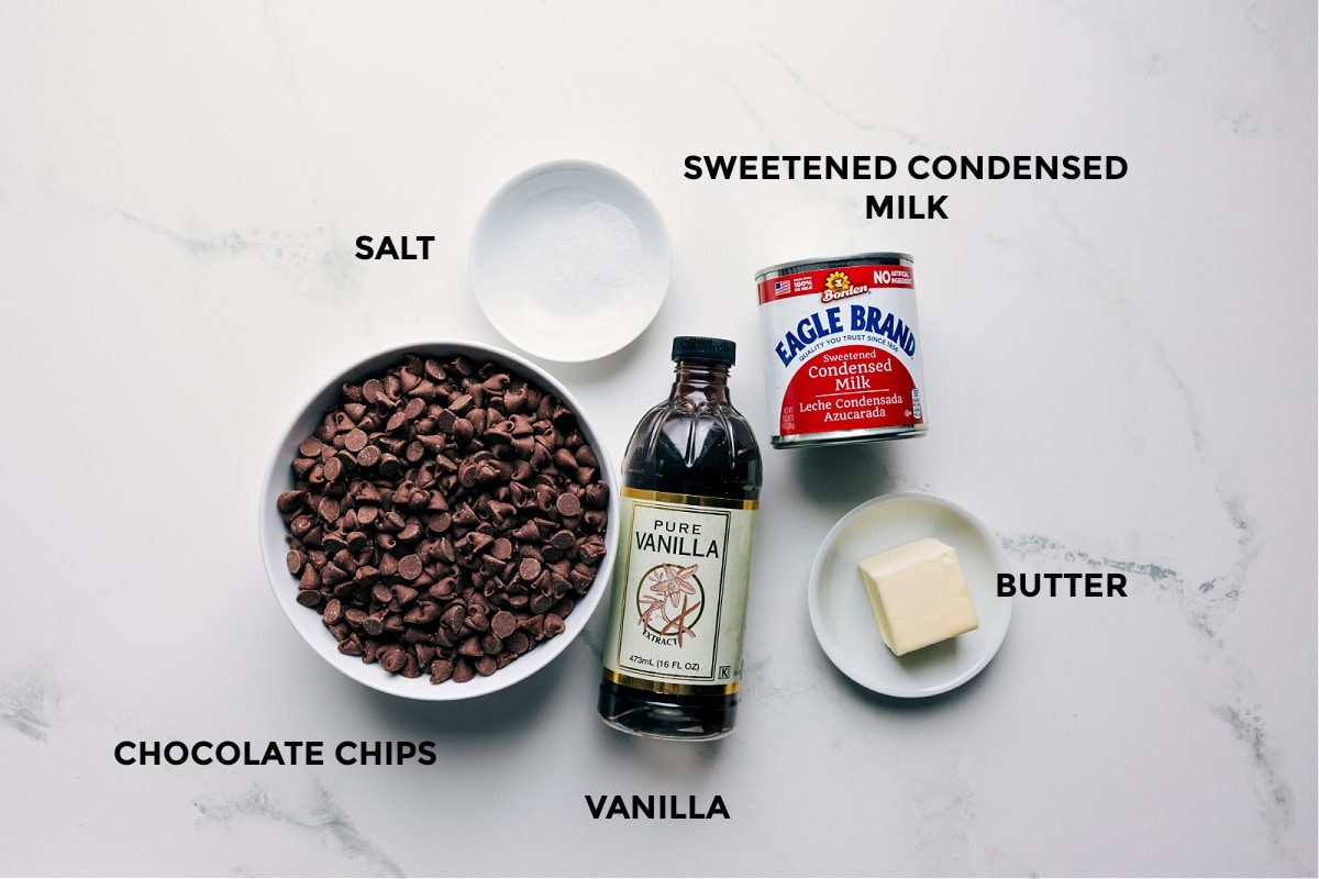 All the ingredients in this recipe prepped out for straightforward assembly including the chocolate chips, salt, vanilla, butter, and sweetened condensed milk.