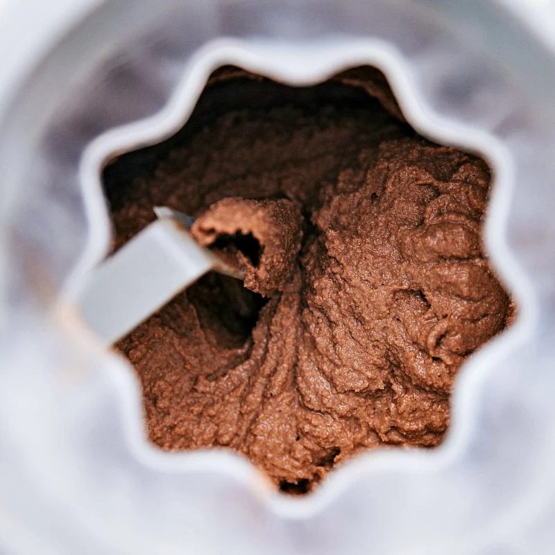 Chocolate gelato churning in the ice cream maker, achieving the reliable creamy texture.