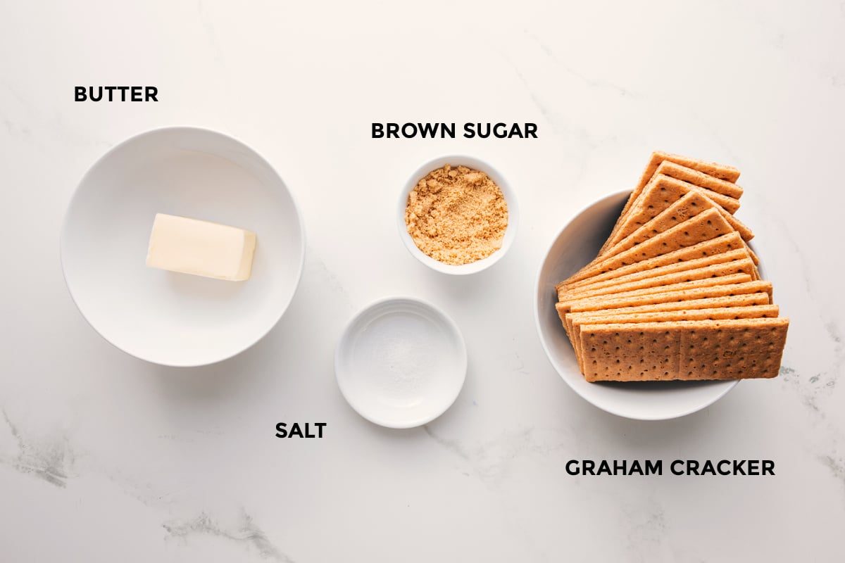 All the ingredients in this recipe prepped out for straightforward assembly including butter, salt, brown sugar, and graham cracker.