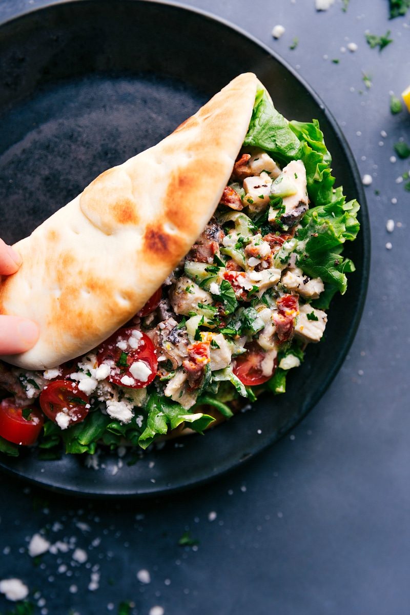 Greek recipes: Greek chicken wrap tucked into warm pita and ready to enjoy.