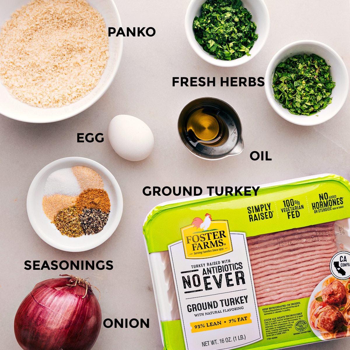 Ingredients for the dish prepped and ready, including panko, fresh herbs, oil, ground turkey, seasonings, and onion.