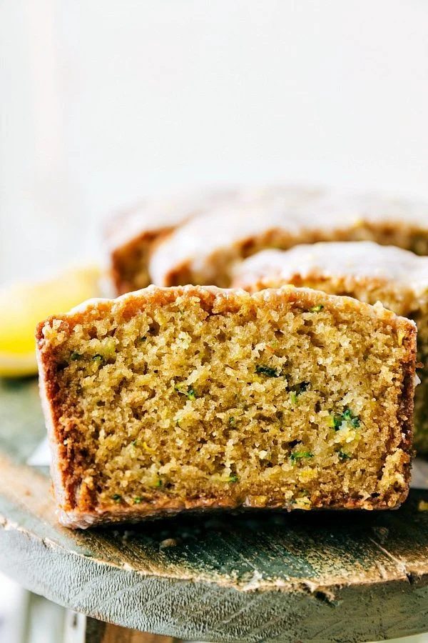 A slice of the moist and satisfying zucchini lemon bread ready to be enjoyed.