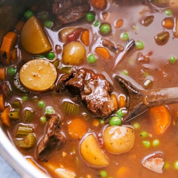 satisfying and hearty beef stew instant pot recipe being stirred before serving.