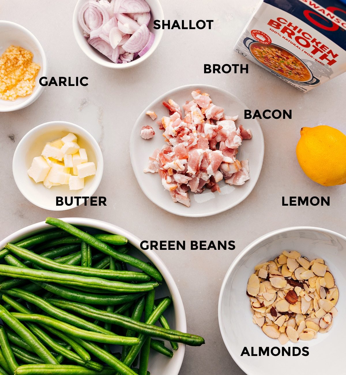 All the ingredients in this recipe—meat, veggies, butter, garlic, broth, lemon, and almonds—are prepped for straightforward assembly.