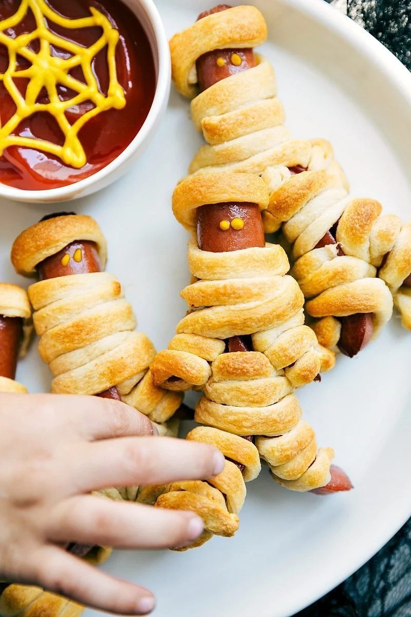 Image of the walking dead mummy dogs that go along with these straightforward halloween appetizers