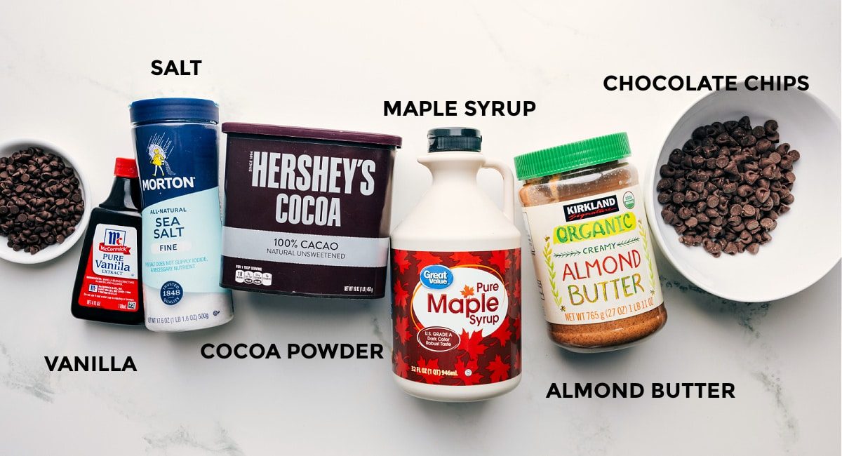 Ingredients in this recipe prepped out for straightforward assembly including the chocolate chips, vanilla, cocoa powder, maple syrup, and almond butter.