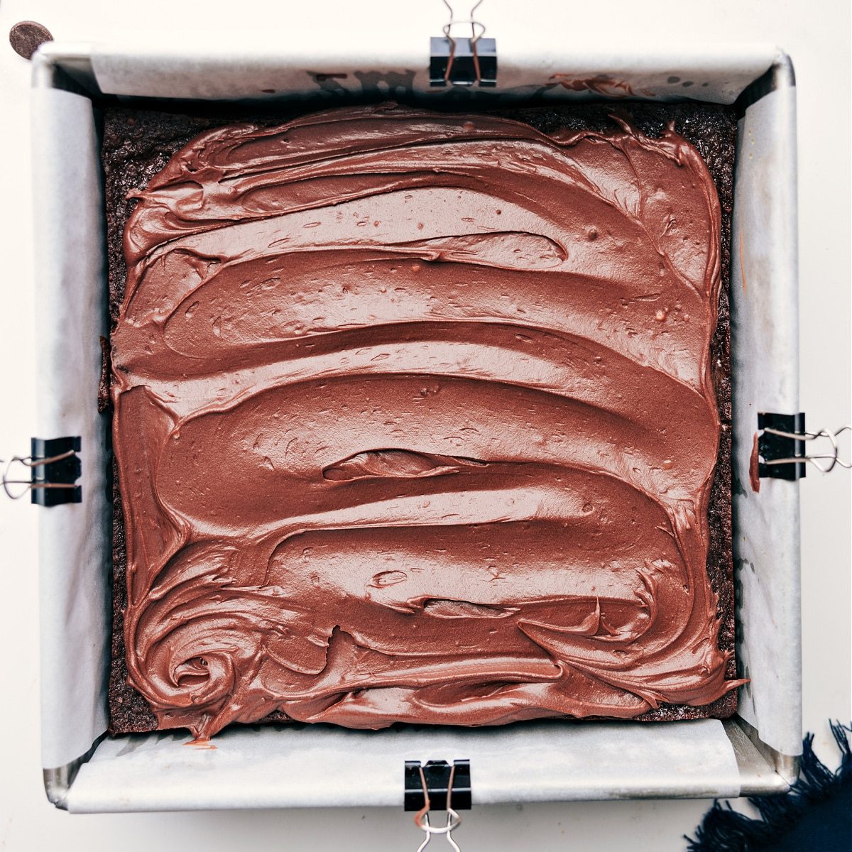 The satisfying frosting spread on the dessert.