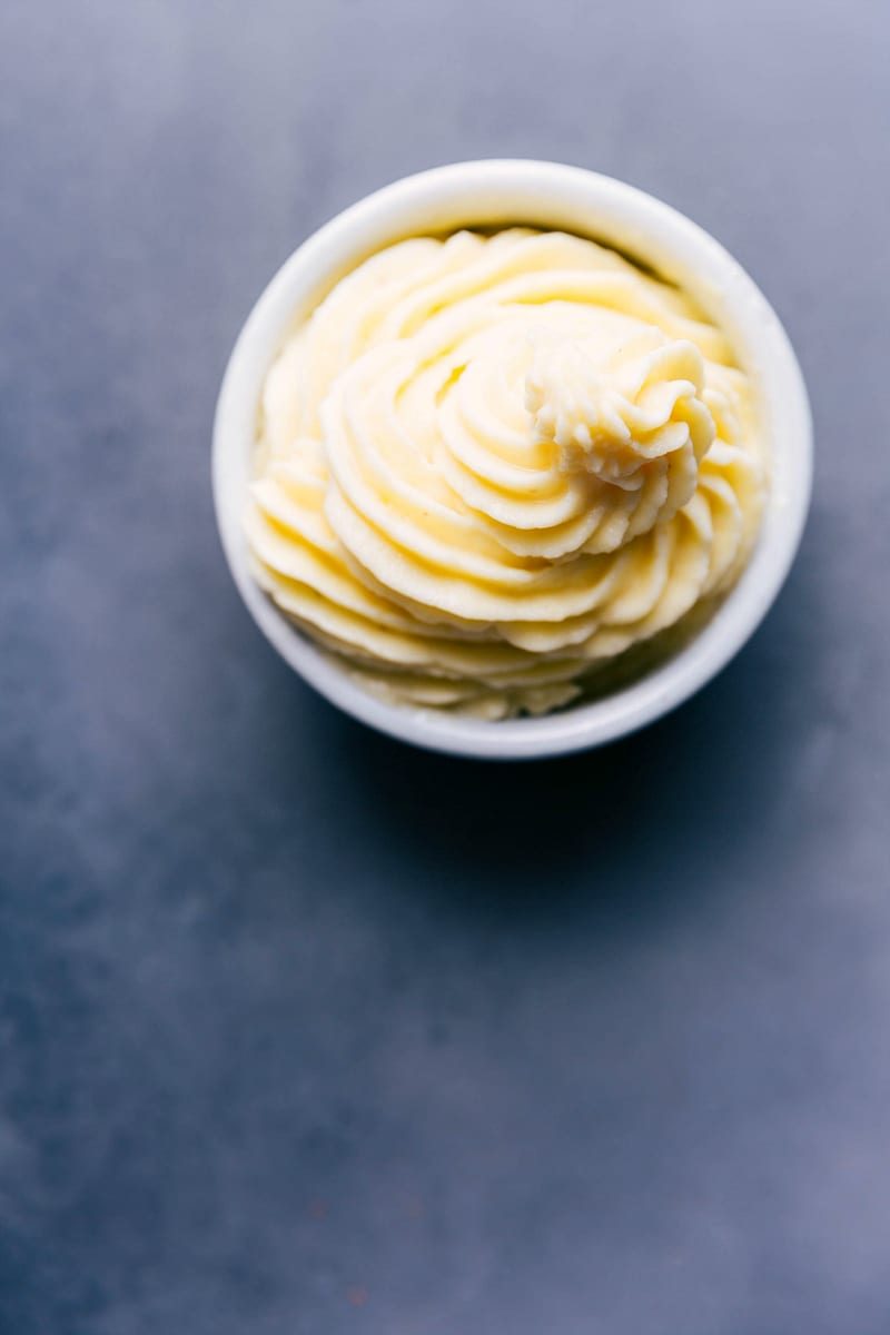 Bowl of from-scratch dole whip, fluffy and sweet, tempting the taste buds.