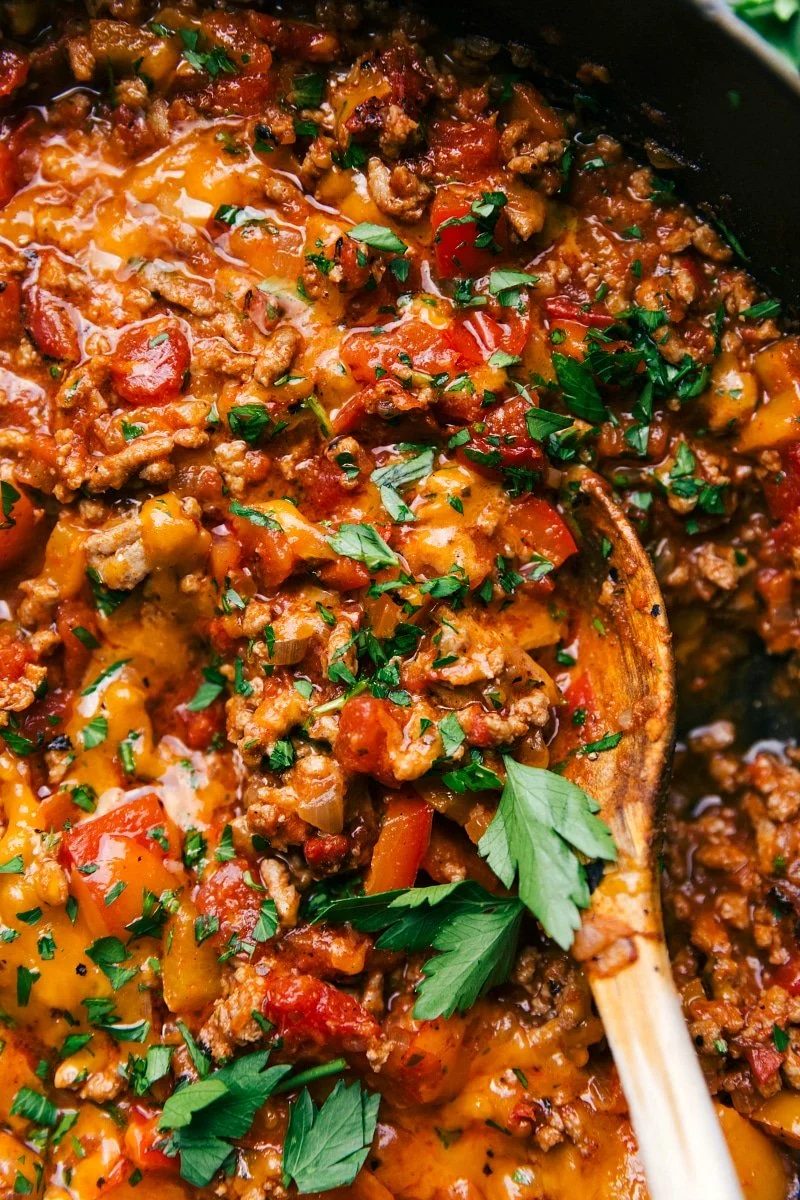 Unstuffed peppers, a pan full of satisfying savory ingredients, including meat and peppers, topped with fresh herbs.