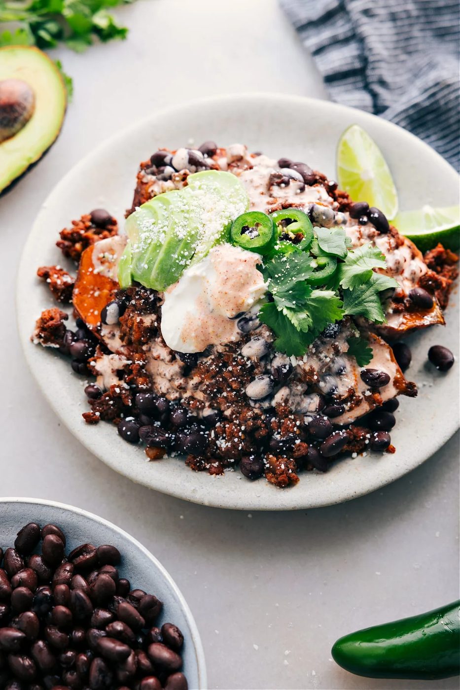 Taco stuffed sweet potatoes piled high with all the best toppings.