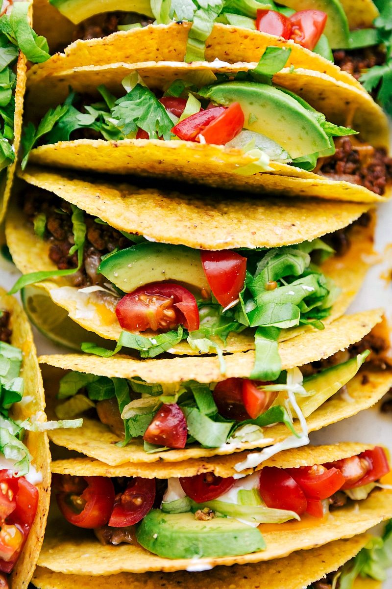 satisfying savory beef tacos in a casserole dish, fully assembled with all the toppings.