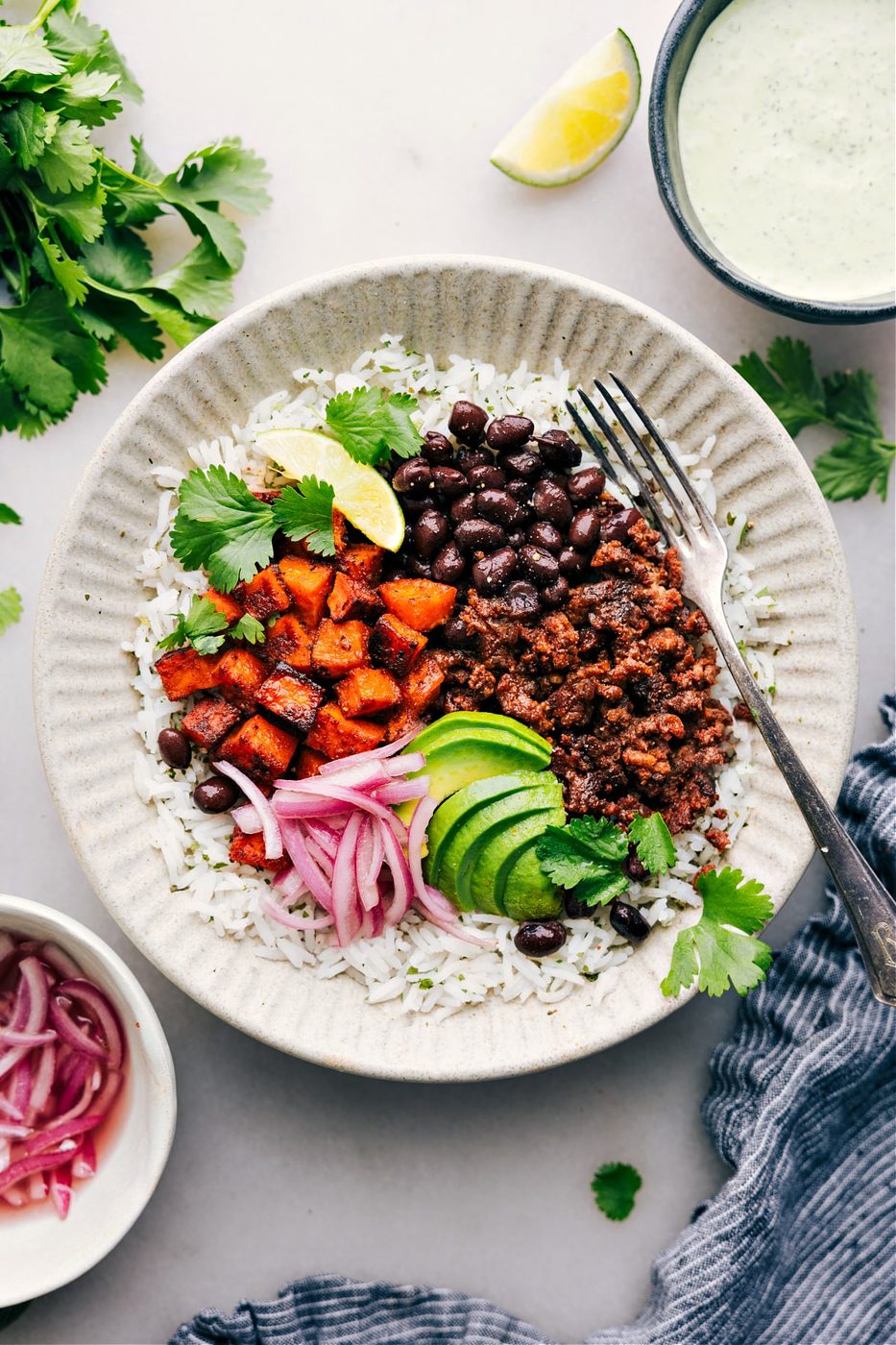 Healthy ground beef recipes: beef burrito bowl recipe with pickled red onions.