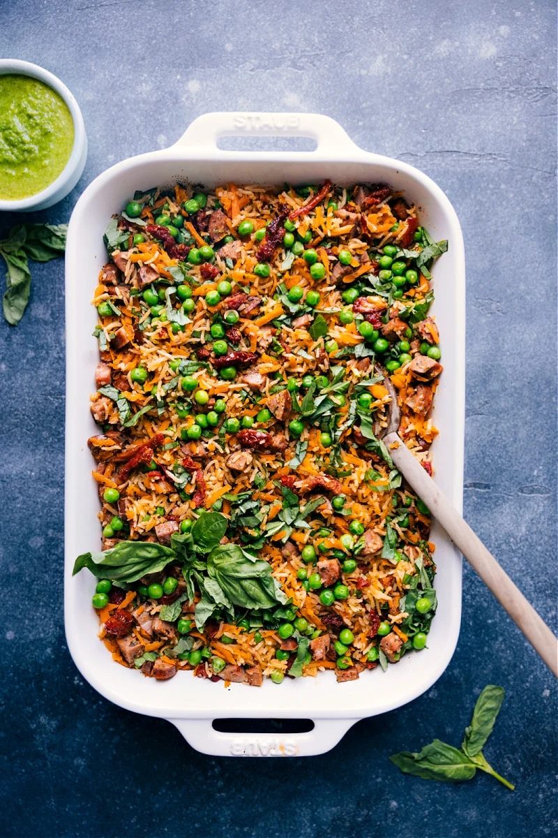 Pesto rice with smoked chicken sausage, vegetables, and fresh basil.