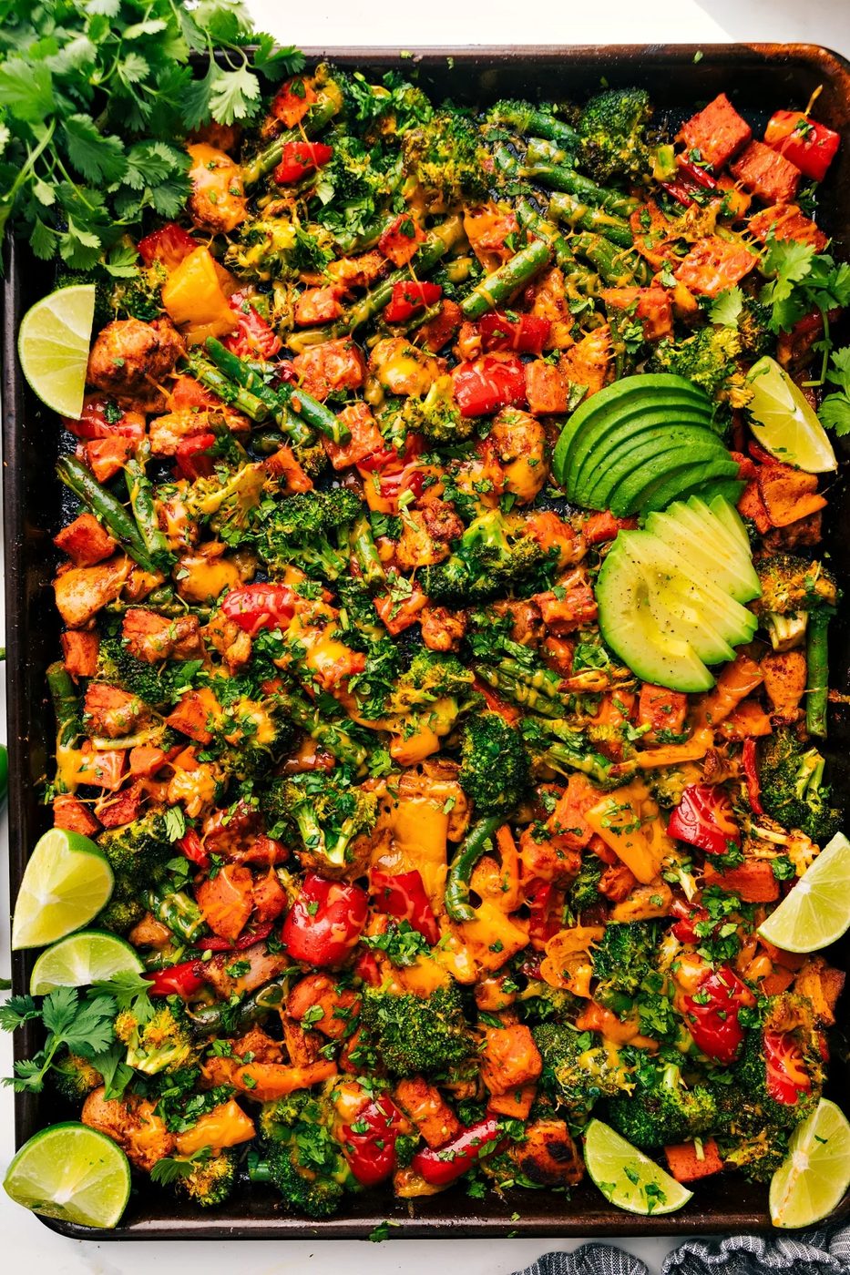 Roasted chicken and tender vegetables in a cheesy healthy one pan meal.