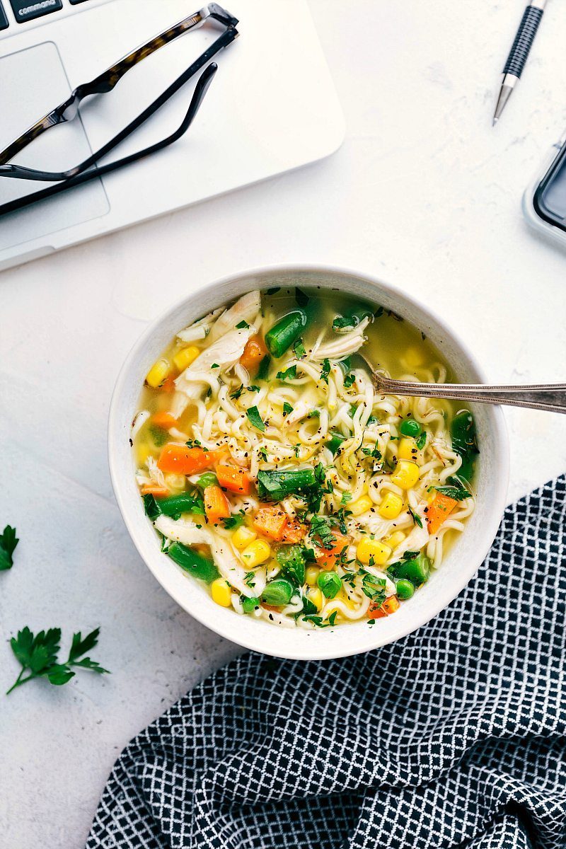 Chicken and veggie soup made up in a bowl.