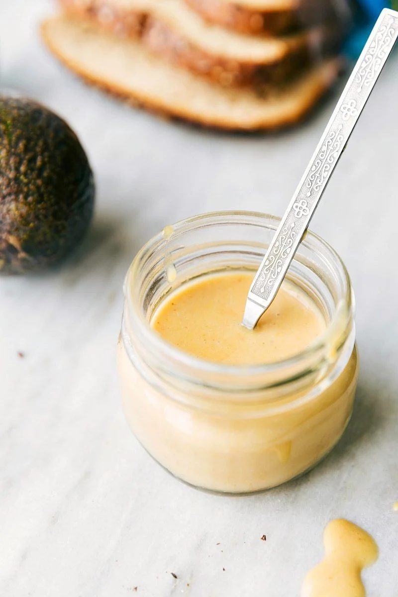 The best honey mustard spread mixed together in a mason jar.