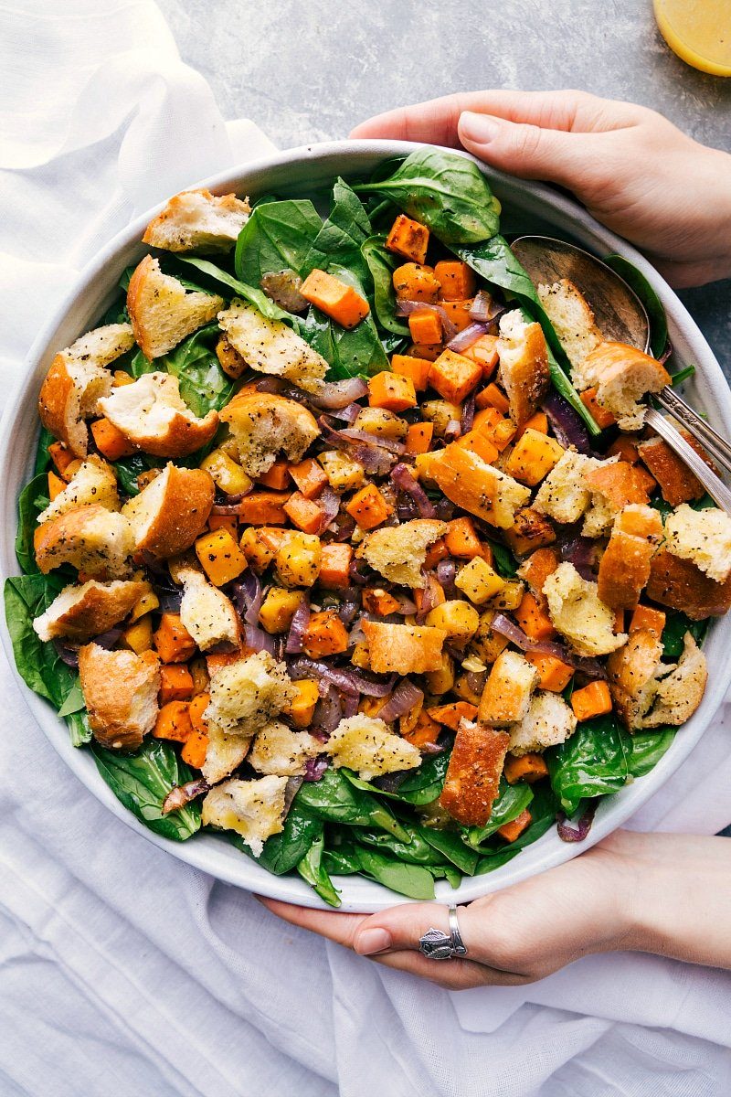 Roasted veggie salad in a giant bowl, satisfying and filling, ready to be served.