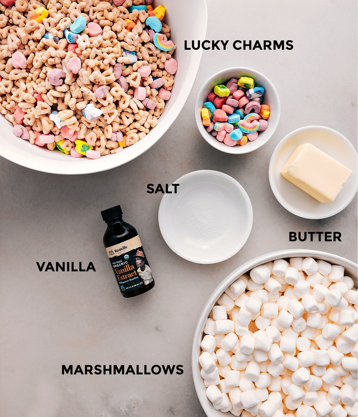 All the ingredients prepped for straightforward assembly: cereal, butter, salt, vanilla, and marshmallows.