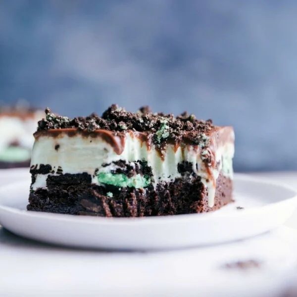 Mint chocolate chip ice cream bar with a revealing bite, showcasing its satisfying layered composition.