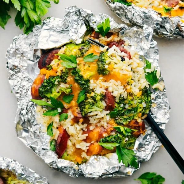 Foil Pack Cheesy Broccoli & Chicken fresh off the grill ready to be enjoyed.