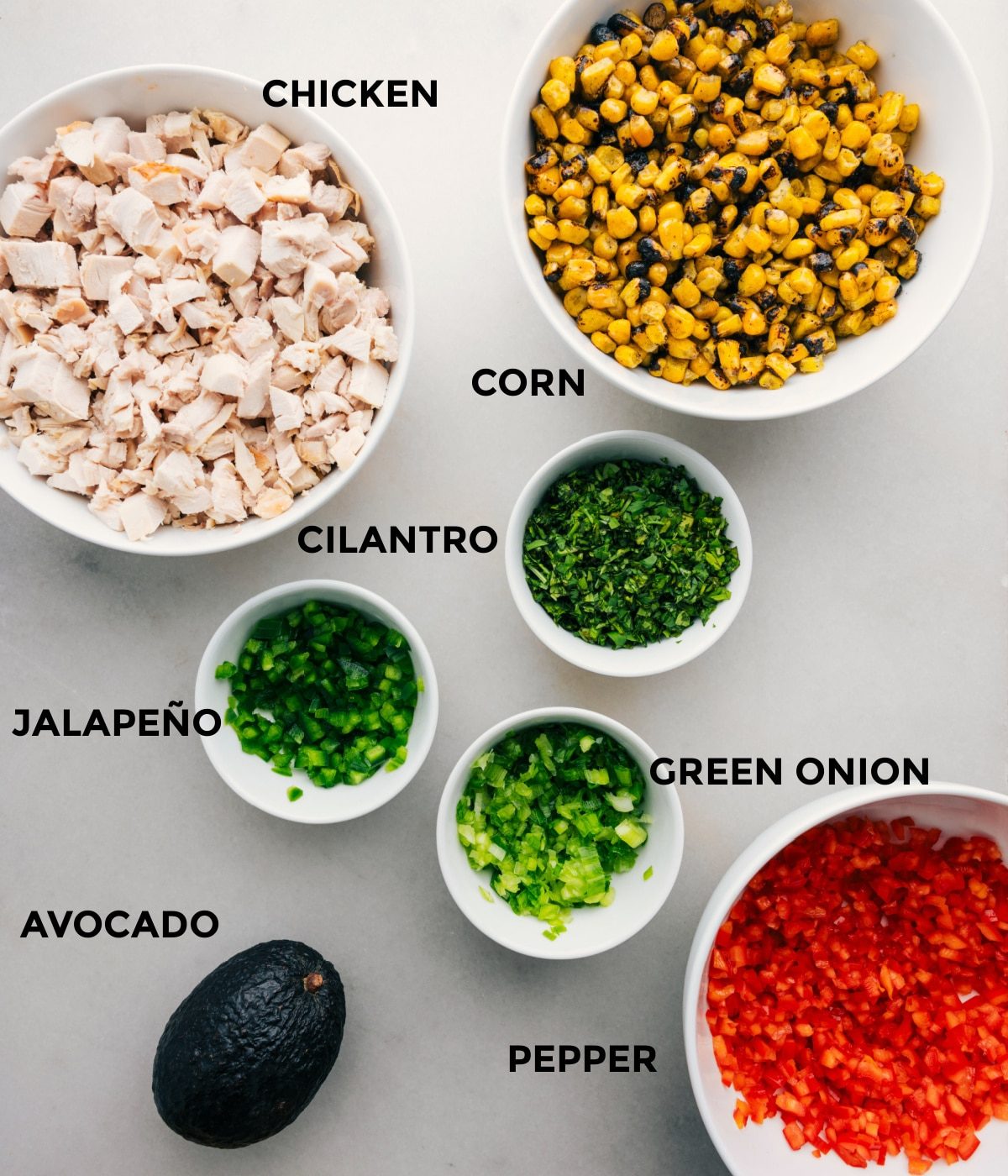 The ingredients for Mexican street corn chicken salad prepped out for straightforward assembly.