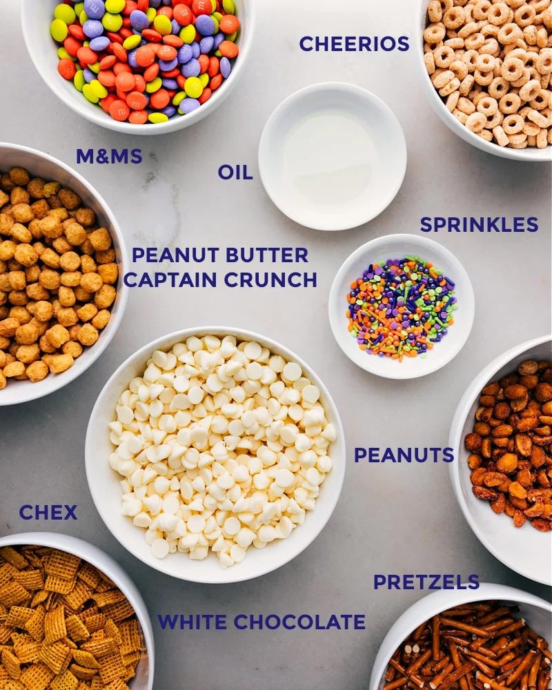 All the ingredients int his recipe prepped out for straightforward assembly including the cereals, oil, sprinkles, peanuts, and M&Ms.