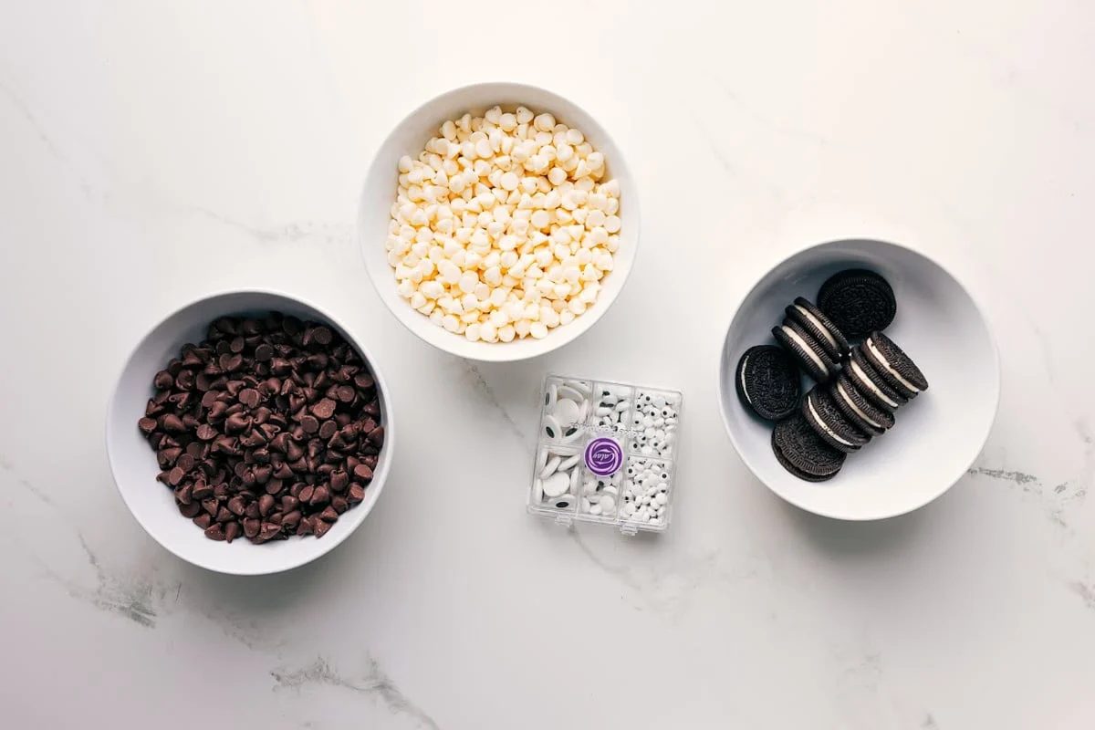 All the ingredients in this recipe prepped out for straightforward assembly including the chocolate chips, eyes, and Oreos.