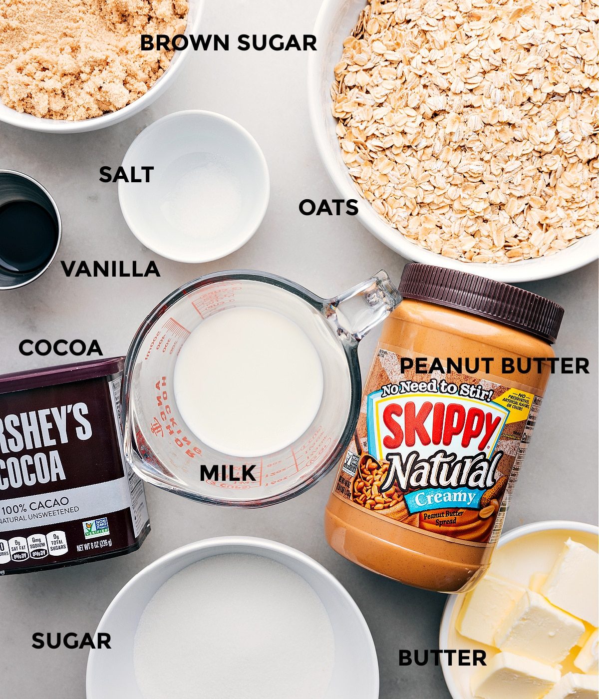 Ingredients in this recipe including oats, salt, peanut butter, vanilla, cocoa, and brown sugar prepped for straightforward assembly.
