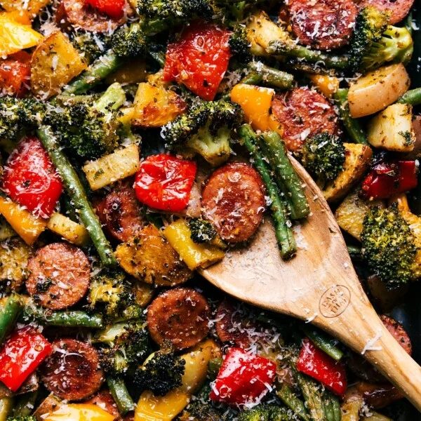 evenly cooked and seasoned sheet pan sausage and vegetables, ready for serving.