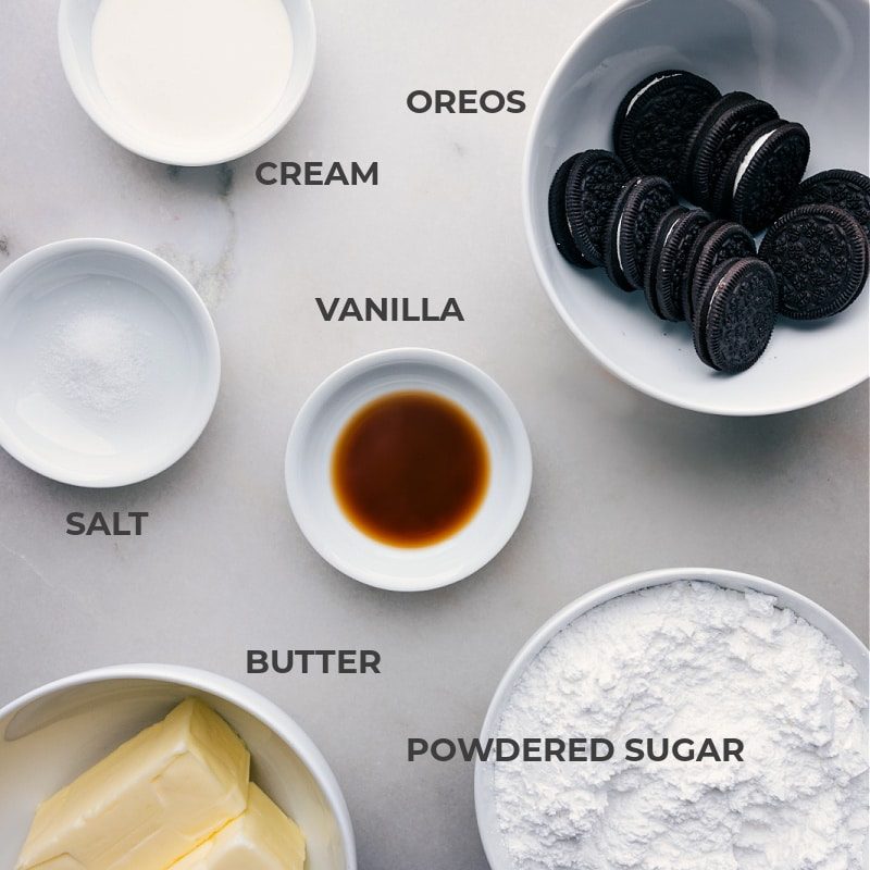 Ingredients in this recipe prepped out for straightforward assembly including the cream, Oreos, salt, vanilla, powdered sugar, and butter.