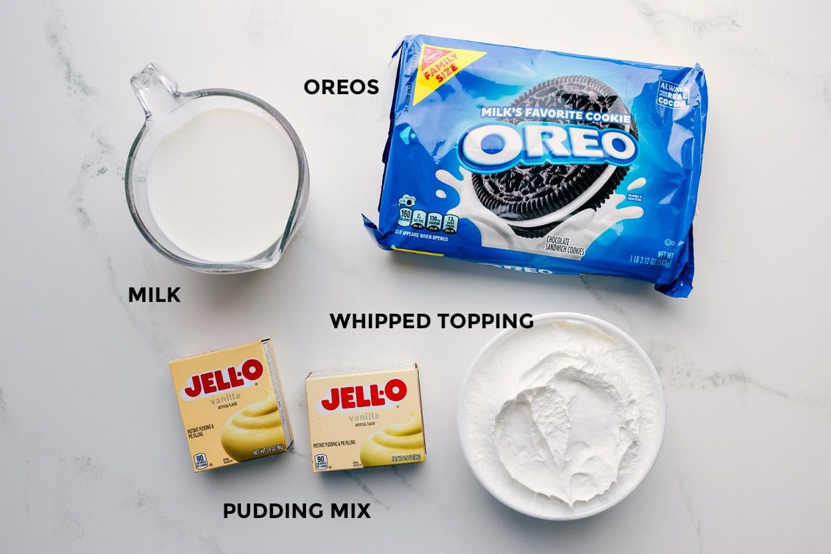 Ingredients prepped for straightforward assembly, including Oreos, milk, whipped topping, and pudding mix.