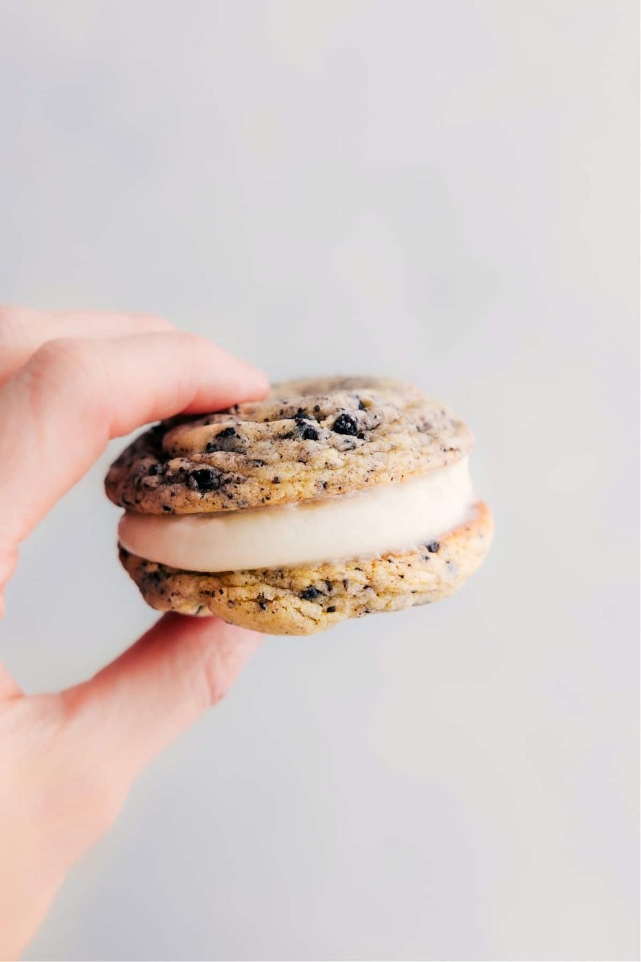 One of the oreo whoopie pies being held up showing the lively layers.