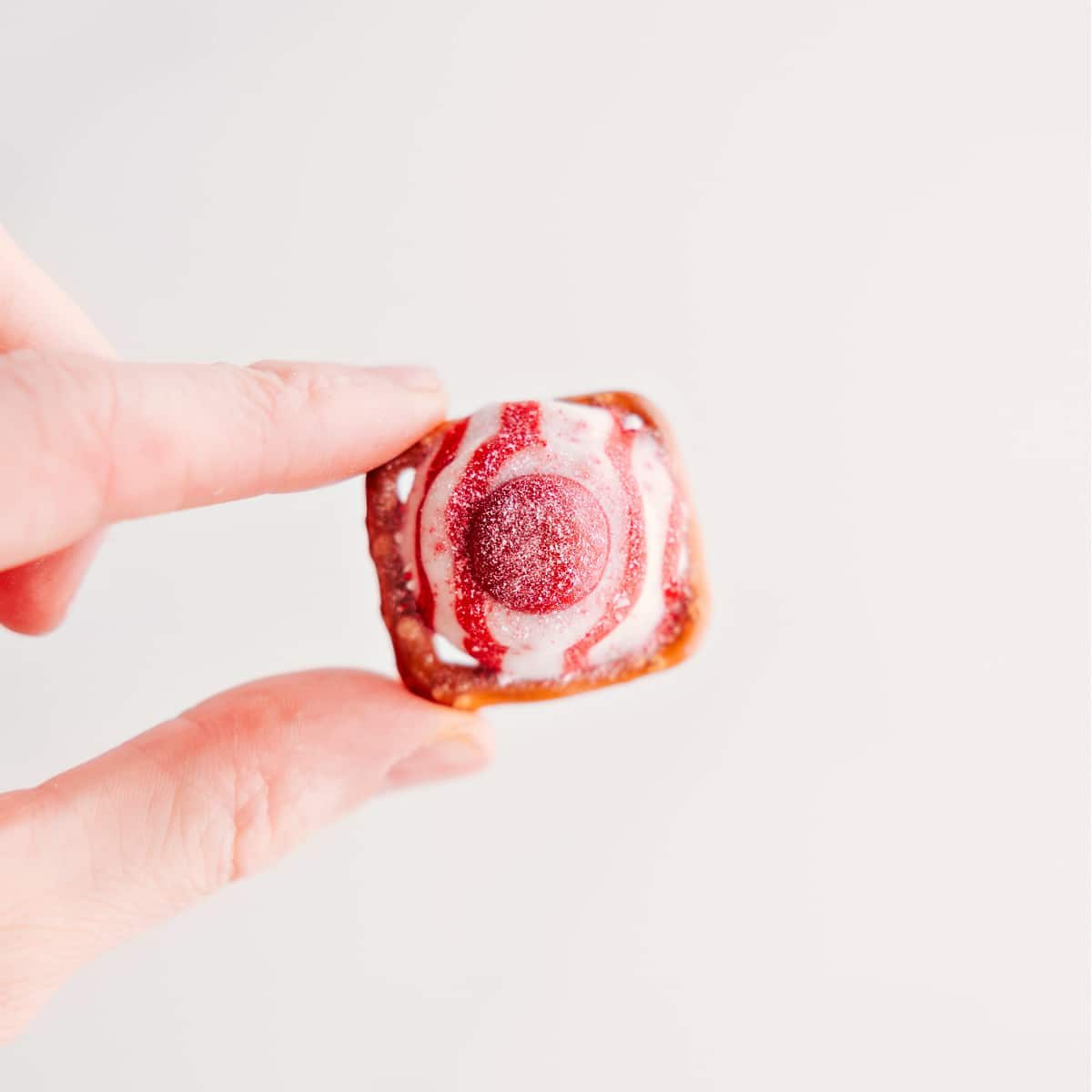 This three-ingredient holiday treat is held up to showcase its deliciousness.