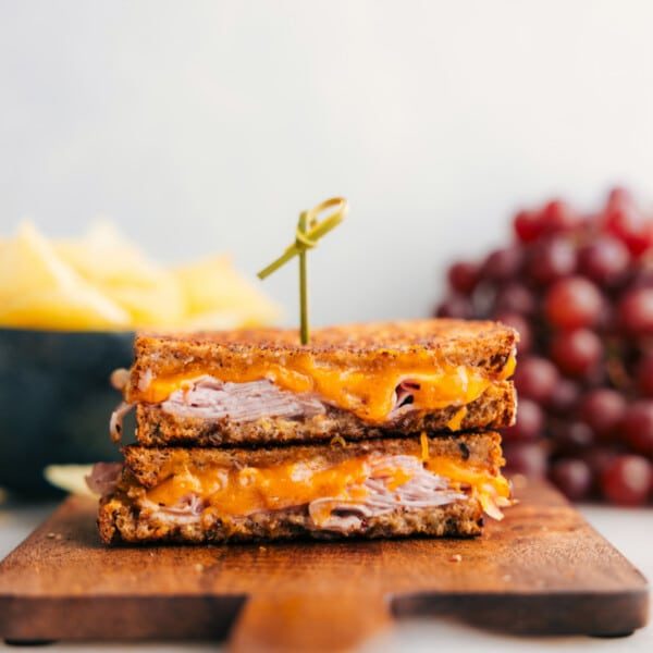 The melty ham and cheese sandwich cut in half showing the satisfying insides.