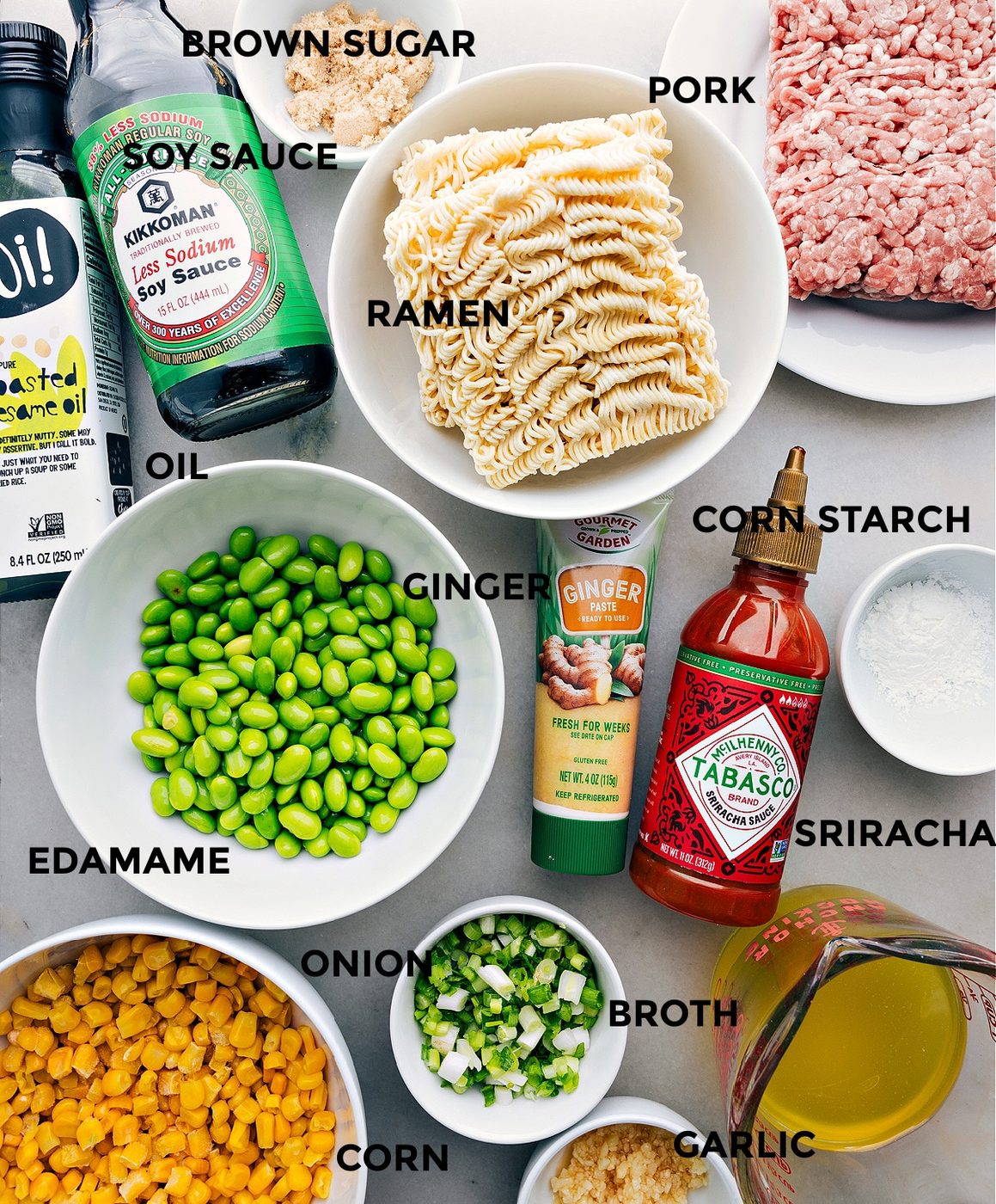 All the ingredients including brown sugar, pork, noodles, ginger, cornstarch, edamame, onion, broth, corn, and garlic all prepped out for straightforward assembly.