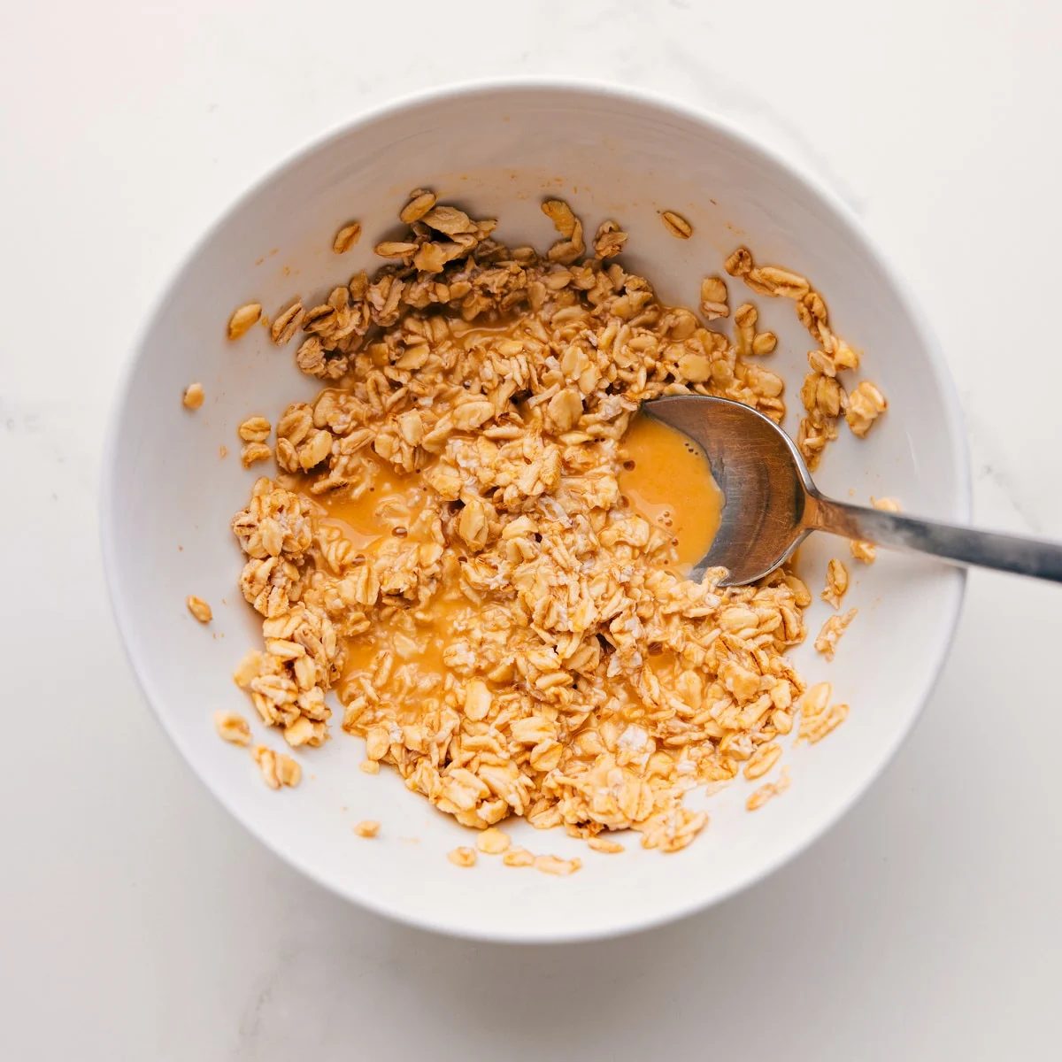 The oats mixed with the orange juice, salt, and vanilla and left to sit overnight for this Princess Diana's Breakfast recipe.