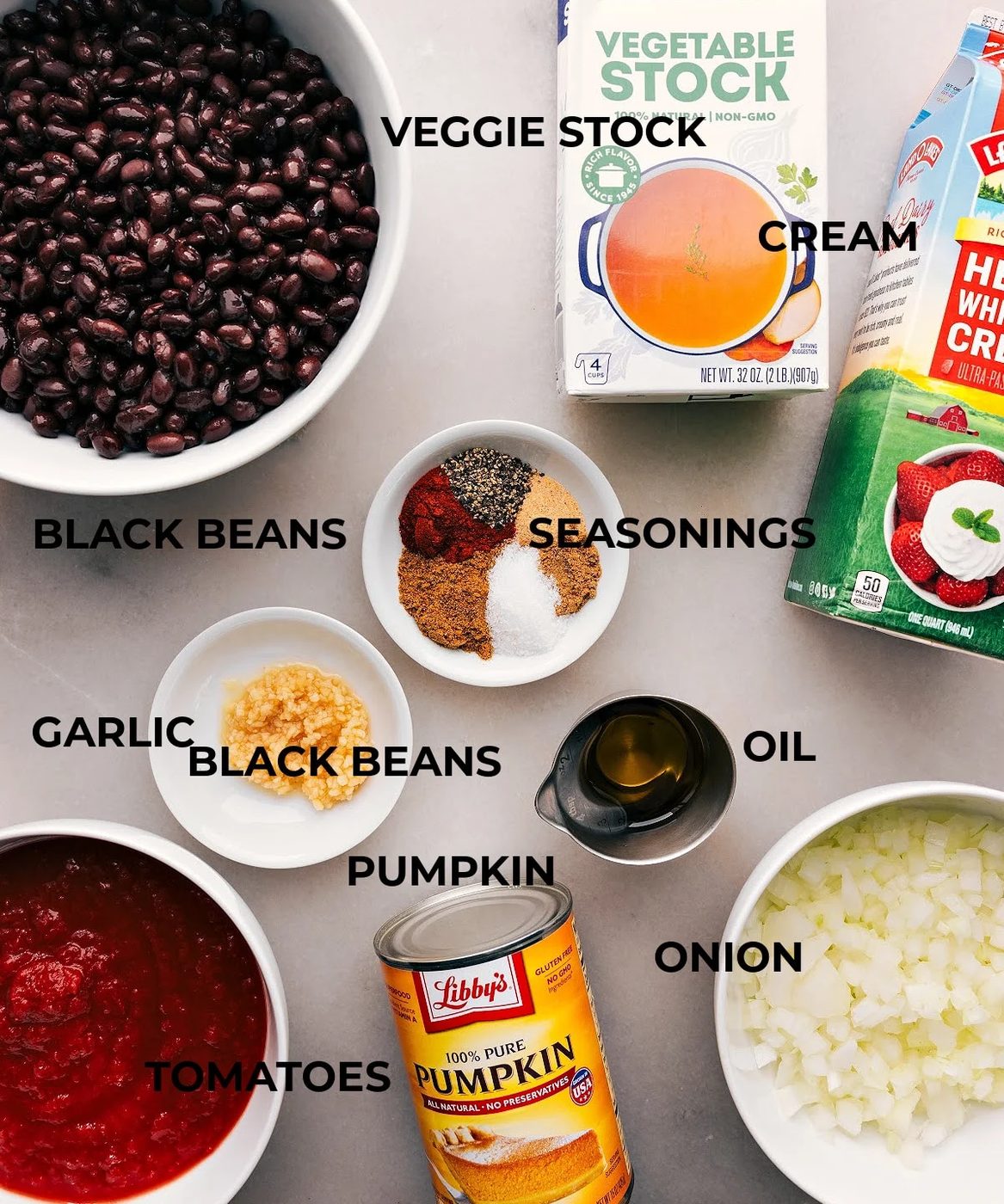 Assorted ingredients for this dish, including pumpkin, black beans, and various spices.
