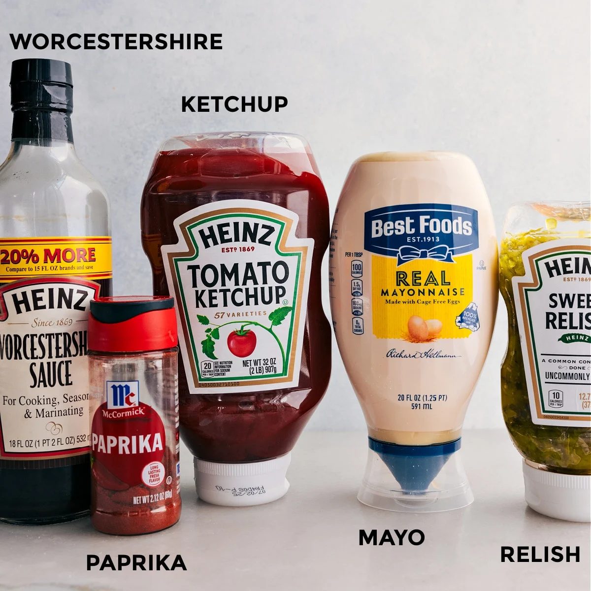 All the ingredients in this recipe including ketchup, mayo, relish, paprika, and Worcestershire sauce prepped out for straightforward assembly.