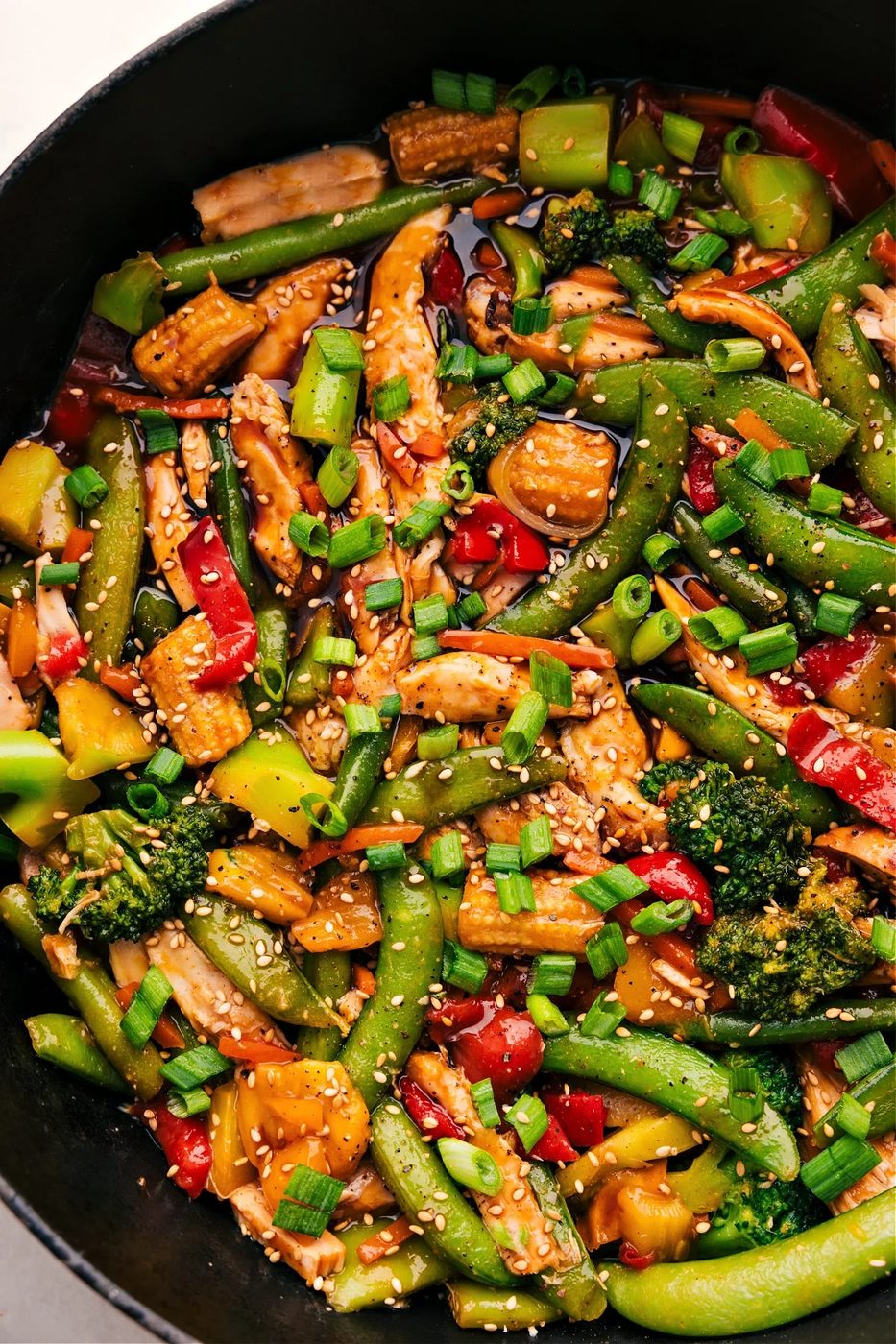 The rotisserie chicken stir fry with its satisfying sauce sits in the skillet, ready to serve and enjoy.