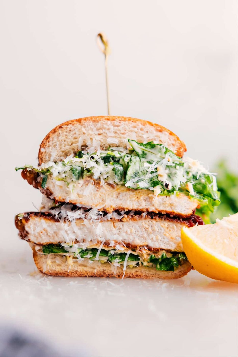 Chicken Caesar sandwich with crispy chicken, Caesar salad, and a buttery roll.