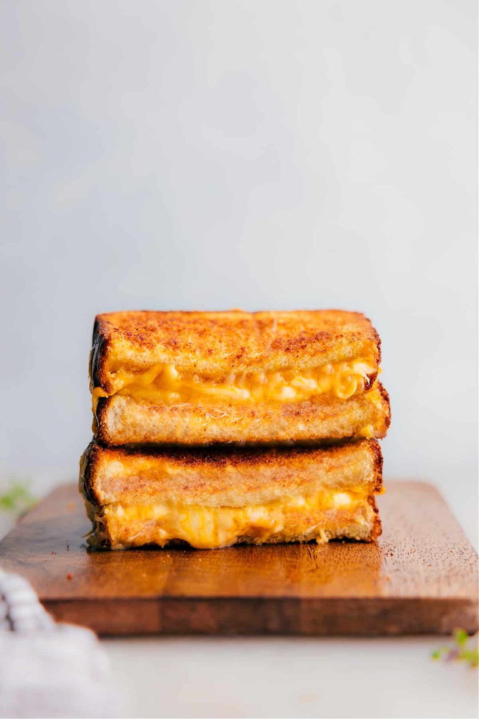 Grilled cheese with crispy bread and three layers of melted cheese.