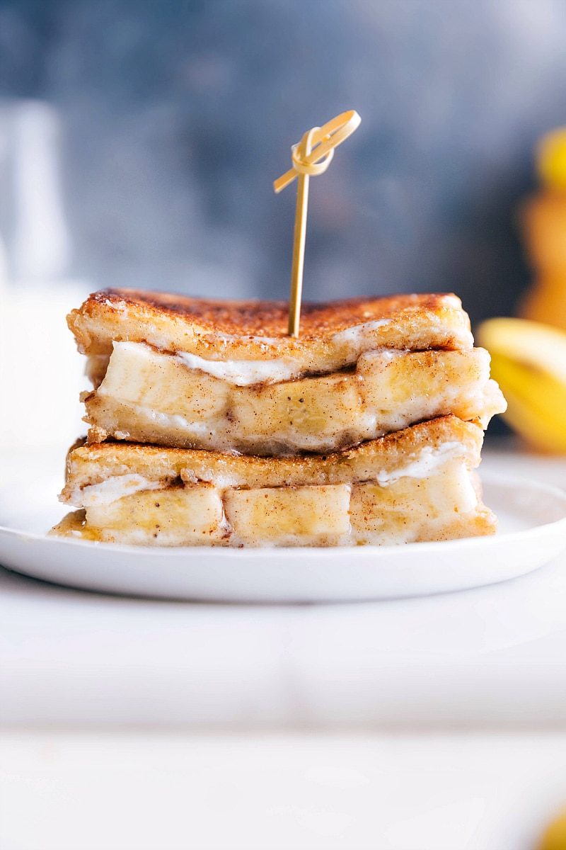 Grilled banana sandwich with mascarpone, sliced bananas, honey, and cinnamon on brioche.