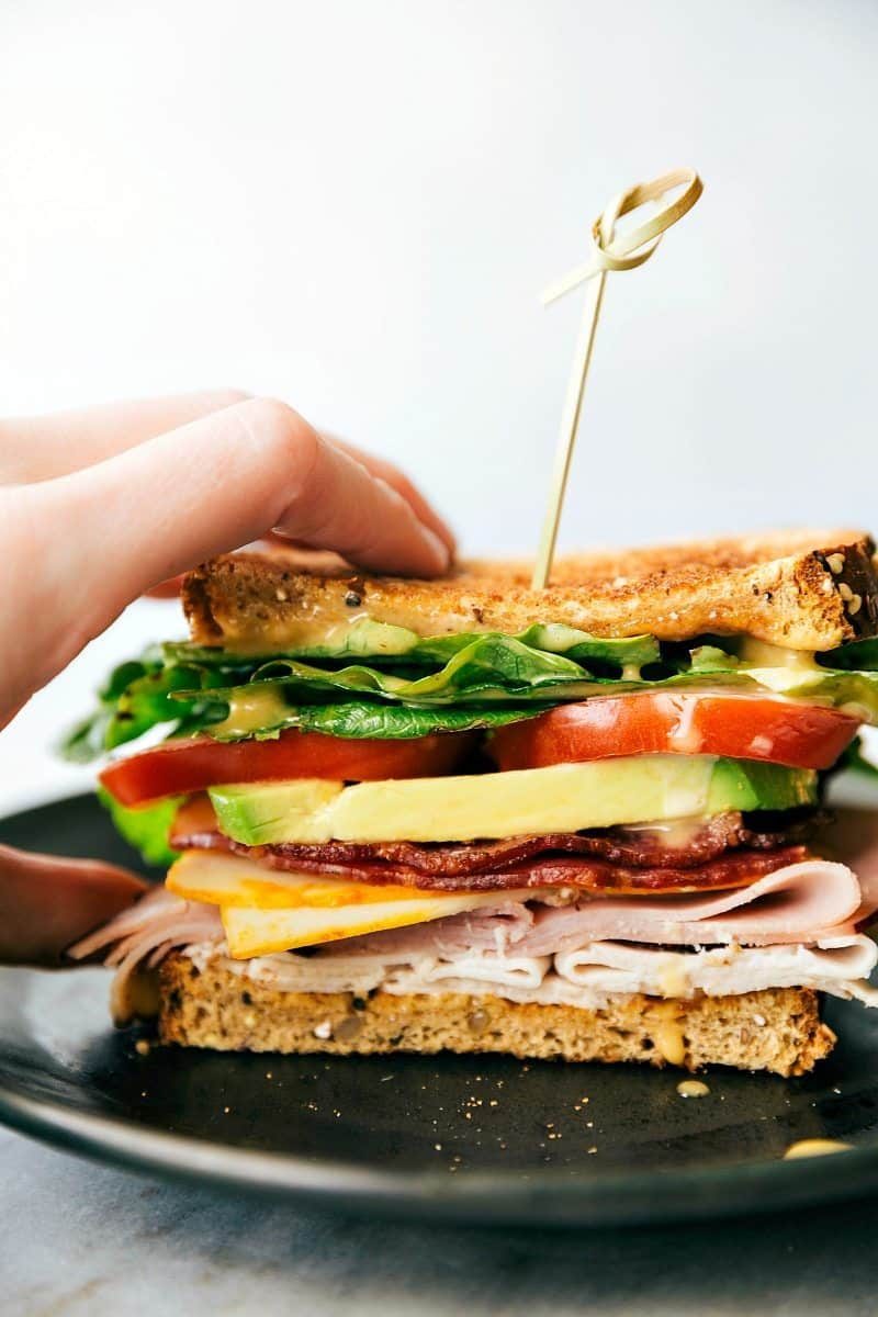 Club sandwich recipes layered with turkey, ham, bacon, Muenster cheese, and honey mustard.
