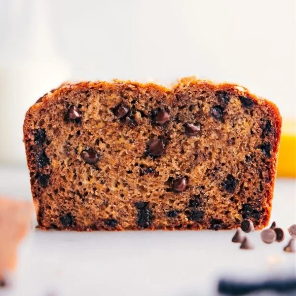 A evenly baked loaf, cut open to reveal the fluffy and satisfying interior with chocolate chips.