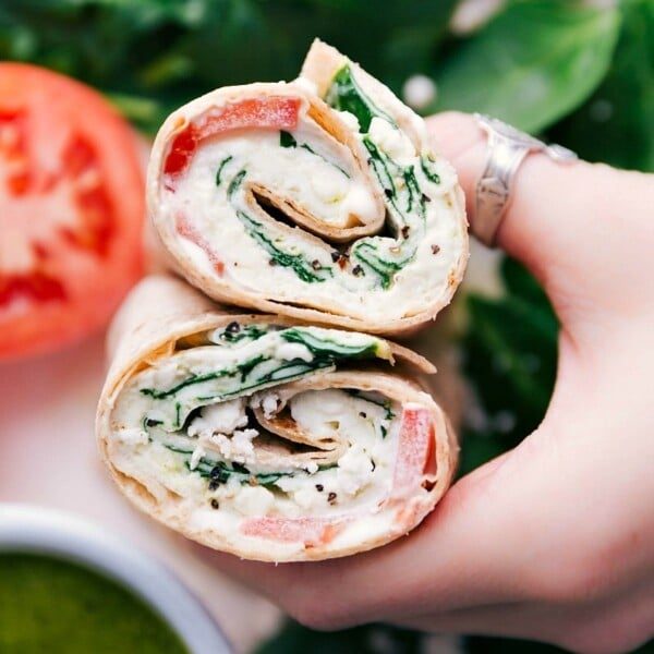 Cut egg wrap revealing its satisfying filling inside both halves.