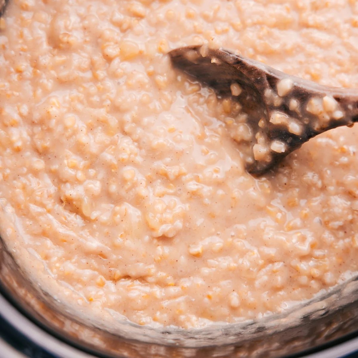 The finished Overnight Steel Cut Oats Recipe in the slow cooker, evenly creamy and ready to serve.
