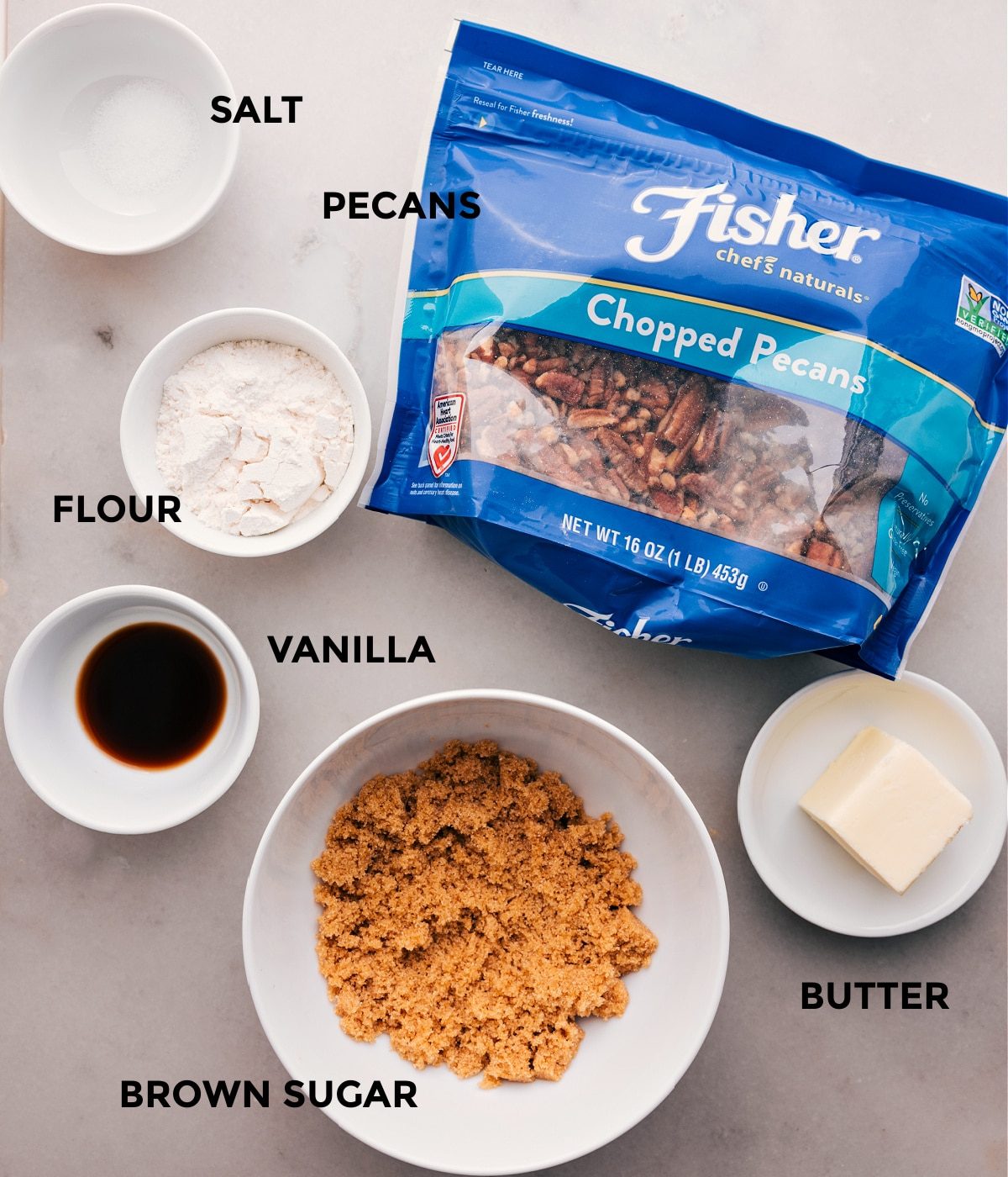 The topping ingredients for this slow cooker Sweet Potato Casserole are prepped: chopped pecans, flour, vanilla, sugar, and butter.